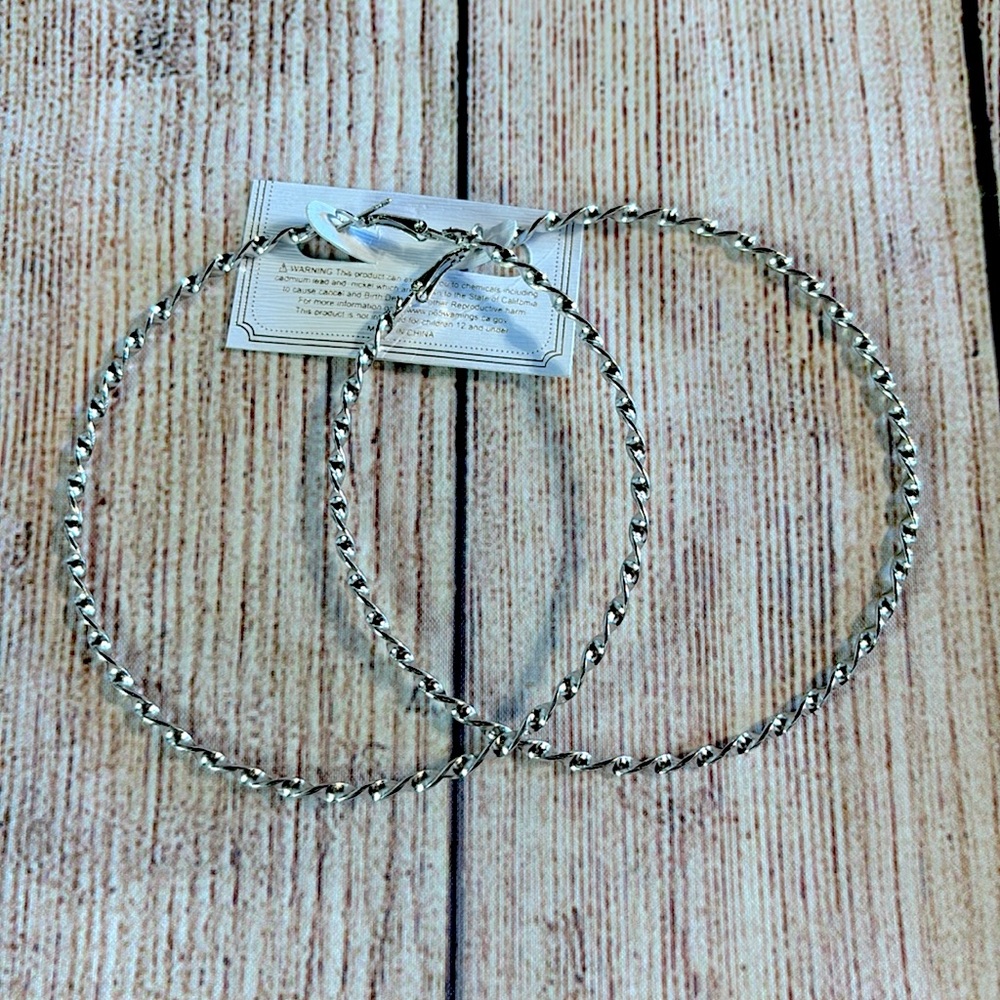 Oversized Silvertone twist hoops